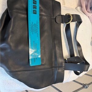 Black Leather Authentic Ladies Coach Tote it is gently used with some marks .